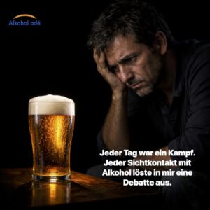 Mann sitzt verzweifelt im Bildhintergrund. Im Vordergrund ein volles Glas Bier